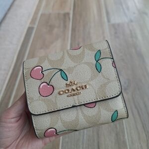 New Coach Corner Wristlet In Signature Canvas With Heart Cherry Print